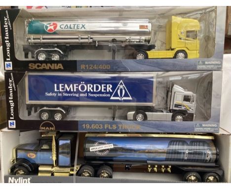 Diecast: A collection of three large scale articulated trucks to include:&nbsp;Nylint Tanker Bandag Tyres, NewRay Man Lemford
