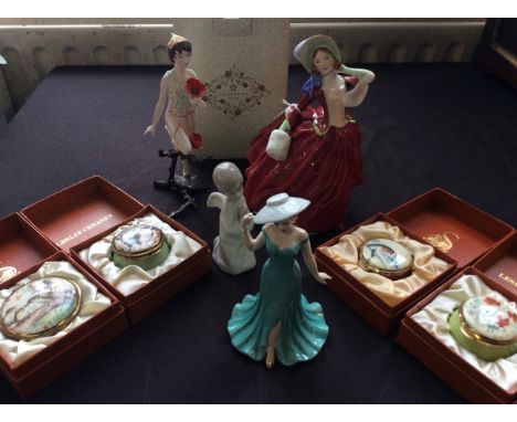 Four figurines including a Royal Doulton Autumn Breezes, Royal Worcester pixie, Nao praying angel and Coalport My Wonderful M