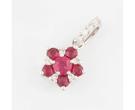 A 9ct white gold ruby and diamond pendant, set in flower design, hallmarked London 2013, weight approx. 1g.