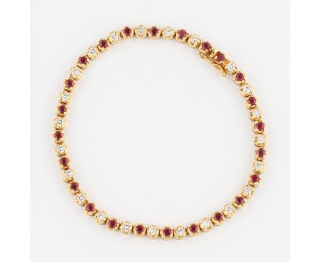An 18ct yellow gold ruby and diamond line bracelet, set alternately with round cut rubies and round brilliant cut diamonds ea