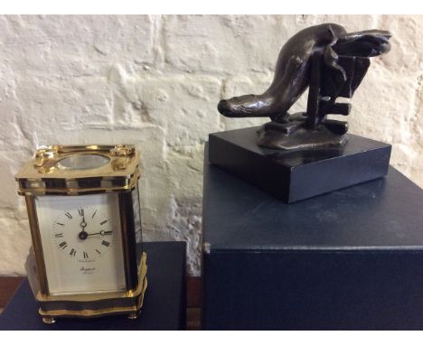 A Rapport brass carriage clock in box, with a Bronzart figurine 'The Diving Otter' in box.