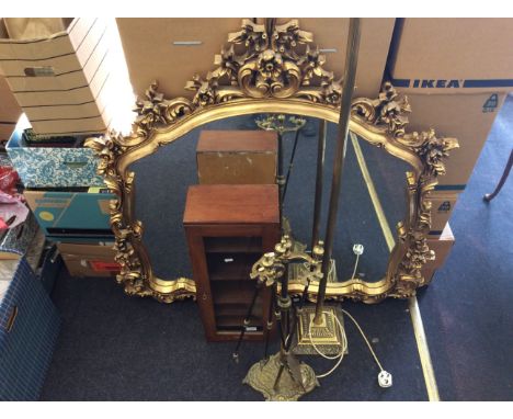 An early 20th Century glazed cabinet by Reynolds & Branson Ltd, brass standard lamp, gilt framed mirror and a brass companion
