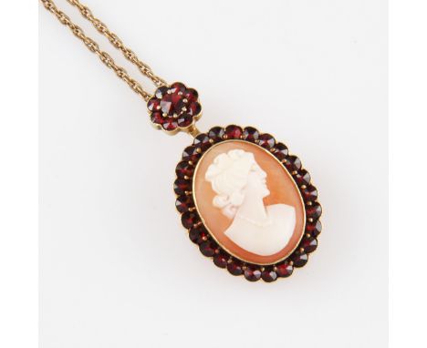 A cameo pendant/brooch, surrounded by a border of red stones, suspended from a red stone cluster surmount, stamped 585, on a 