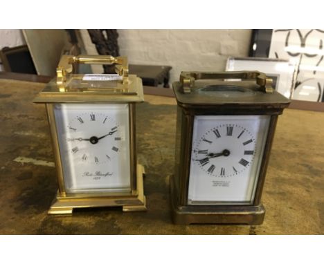 An early 20th Century brass cased carriage clock marked to face Harrods Ltd London Paris Made in France, together with a late