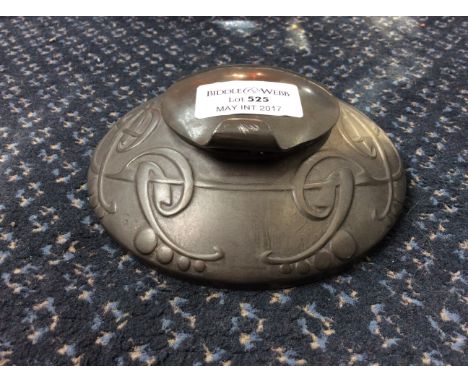 An early 20th Century Archibald Knox for Liberty & Co pewter inkwell of squat form with relief design, marked to base 'Englis