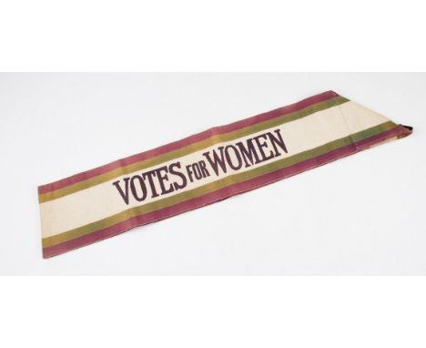 An early 20th Century Suffragettes movement tricolour fabric sash, having cream, green and mauve coloured bands with the cent