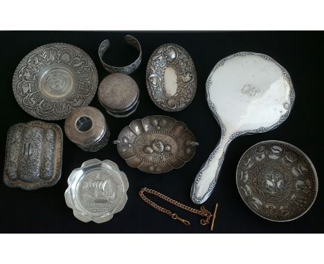 A lot to include a hallmarked silver lidded hair tidy and a jar, two Victorian hallmarked silver repousse dishes, a hallmarke