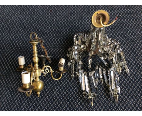 An early 20th Century chandelier with crystal droppers together with a brass three branch ceiling light. (2)