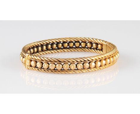 A Victorian hinged bangle, of rope twist and sphere design, clasp stamped 15ct, weight approx. 18.3g.