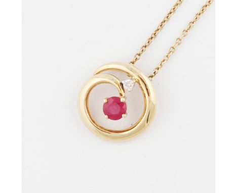 A ruby and diamond pendant, the open metalwork design set centrally with a round cut ruby, surmounted by a round brilliant cu