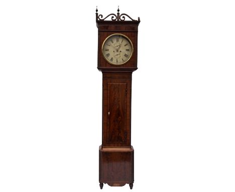 A Regency mahogany longcase clock the eight-day duration movement striking the hours on a bell with the fourteen-inch round p