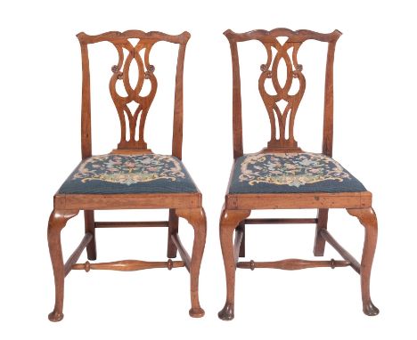 A pair of late George II or George III walnut side chairs in Chippendale taste, circa 1760; with serpentine toprails above ca