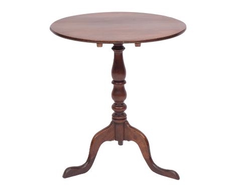 A George III oak and mahogany tripod table, late 18th century; the oval flip top with knop turned shaft; 64cm high,61cm long