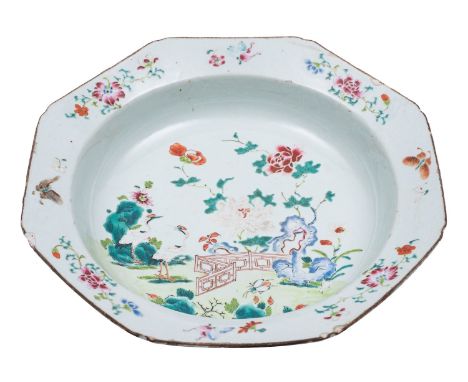 A Chinese famille rose octagonal deep dish/basin painted with a fenced garden with cranes, butterflies, blue rockwork, flower