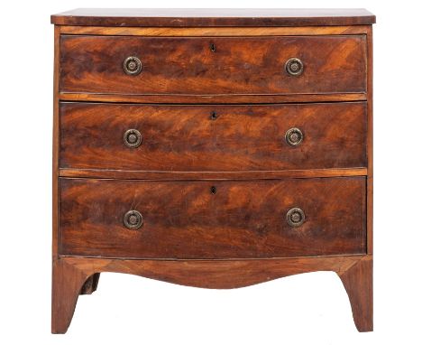 A mahogany bow-front chest of drawers in the Georgian manner, early 19th century; the bow shaped top above three long drawers