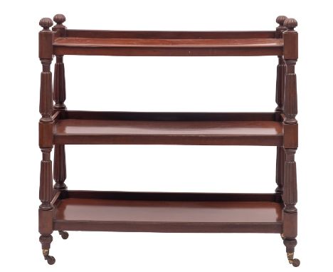 A William IV mahogany three-tier buffet, circa 1835; with lobed finials at the upper corners, above three shelves with three-