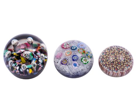 A Caithness Harlequin paperweight and two others, the former probably by Paul Ysart, the scrambled coloured ground set with n