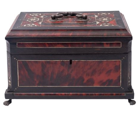 An Indo-Colonial ebony and tortoiseshell tea caddy, early 19th century; with three interior lidded canisters, inlaid with geo