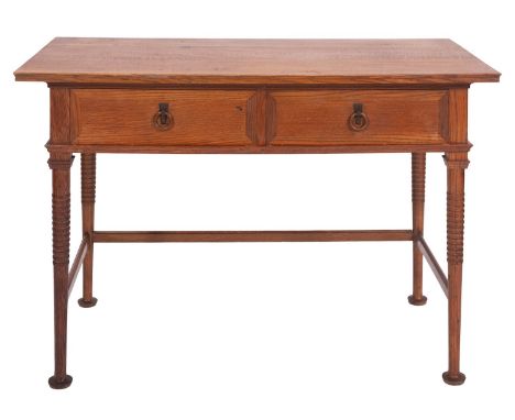 An oak dressing table in Arts & Crafts style, possibly for Heal & Co., early 20th century; the twin drawers with cleated fron