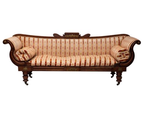 A 'Regency-Empire' carved mahogany and upholstered sofa, circa 1815; the backrest with raised and projecting tablet with (an 