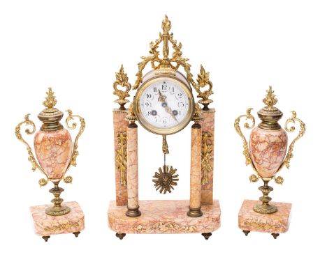 A 20th century breccia rossa stone cased mantel clock garniture, the eight-day duration movement striking the hours and half-