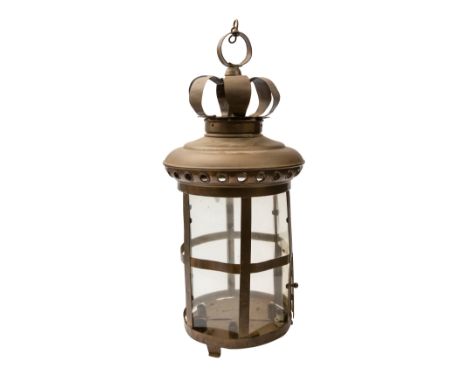 A brass and glazed hanging lantern, early 20th century; with hanging ring above an openwork corona and shallow domed top; the