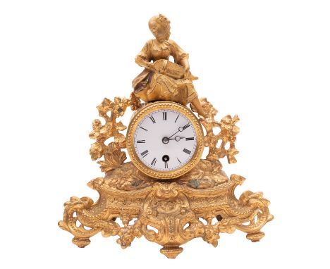 A French gilt spelter mantel timepiece, having an eight-day duration timepiece movement, the white enamel dial with black Rom