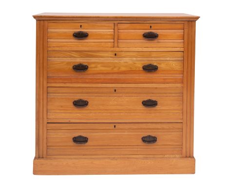 An Edwardian ash chest of drawers by Harris Lebus of London, probably for Maple & Co., early 20th century; the top with mould