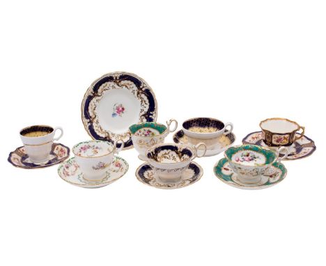 A group of tea wares, comprising a Coalport trio decorated with flowers on a green ground, an unidentified trio, a Minton cup