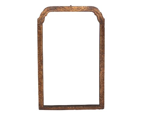 A George II giltwood and composition framed wall and dressing table mirror; second quarter 18th century; of cusped arched for