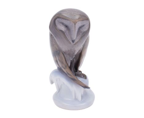 A Royal Copenhagen figure of a Barn Owl on snow covered mound base, underglaze blue and green printed marks with model no.273