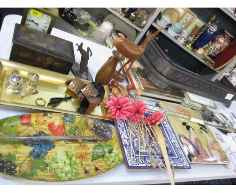A mixed lot comprising a 1988 Coral carriage clock, a vintage pictorial tin, trays, silver plate, a cow bell, treen, a paper 