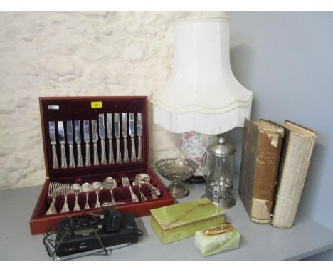 A Cooper Ludlam cased silver plated canteen of cutlery, a porcelain table lamp with shade, onyx cigarette box and table light