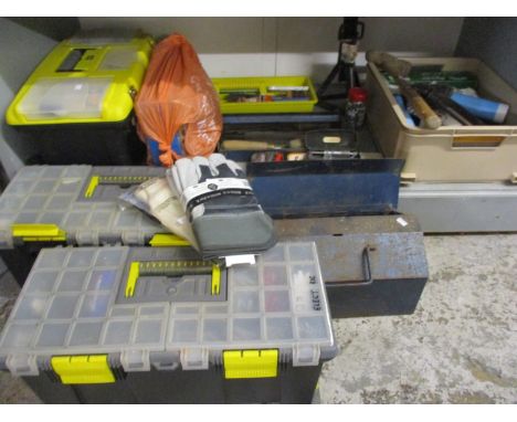 A box of miscellaneous paintbrushes and garage related tools, tool boxes, an extension cable and electrical accessories 