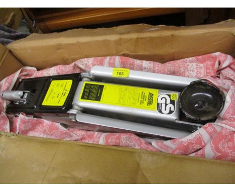 A two ton hydraulic trolley jack model number TJ4000 together with a garden fork and spade and a tool box 