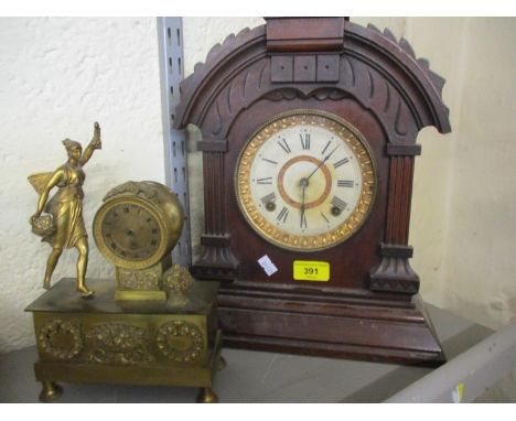 A late 19th century American walnut mantle clock, together with a gilt metal mantle clock fitted with a French pocket watch m