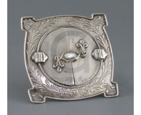 A George V Arts &amp; Crafts silver and moonstone mounted photograph frame by Ramsden &amp; Carr, London, 1910, of shaped cir