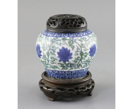 A rare Chinese doucai 'lotus flower' jar, Wanli six character mark and probably of the period, (1573-1619), of squat baluster