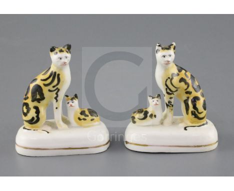 A rare pair of Staffordshire porcelain groups of a cat and a kitten, c.1835-50, H. 7.5 and 7.7cmCONDITION: Provenance - Denni