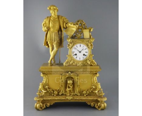 Dupuis à Paris. A mid 19th century French ormolu mantel clock, of architectural form, surmounted with the figure of a medieva