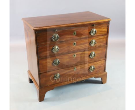A George III mahogany chest with brushing slide and four graduated long drawers. on bracket feet W.2ft 10in. D.1ft 7in. H.2ft