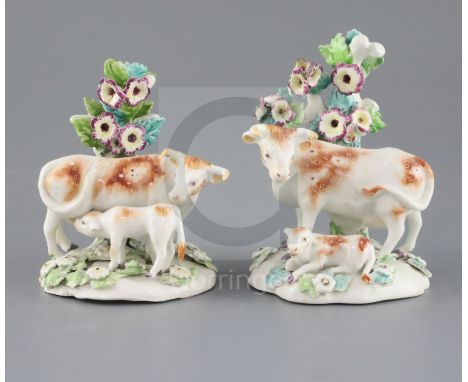 A near pair of Derby groups of a cow and calf, c.1760-5, on flower encrusted bases, patch marks, H. 11 and 12.7cmCONDITION: P
