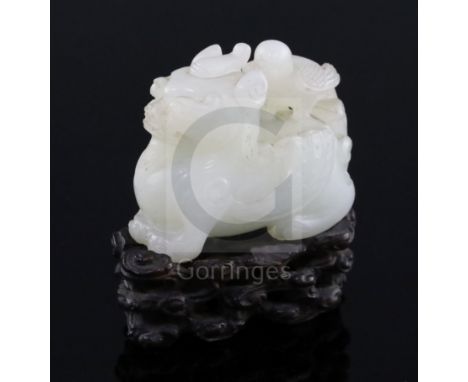 A Chinese white jade figure of bixi with a bird on its back, 17th/18th century, the stone of good even tone with a few paler 