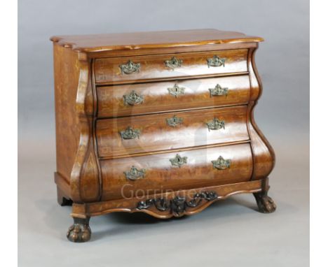 A 19th century Dutch walnut and marquetry bombe commode, with serpentine top and four long drawers, on claw and pad feet, W.3