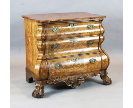 A 19th century Dutch walnut and marquetry bombe commode, with serpentine top and three drawers, on claw and pad feet, W.3ft 4