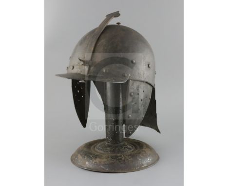 A good heavy 17th century cavalry trooper's helmet, one piece skull, button shaped finial, fixed peak with adjustable nasal b