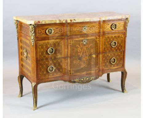 An early 20th century French Transitional style marquetry breakfront commode, with mottled serpentine marble top and three gr