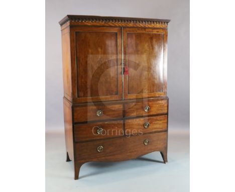 A George III Hepplewhite period mahogany dwarf linen press with moulded cornice and two panelled dooors over two shirt and tw