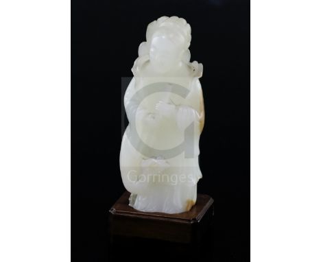 A fine Chinese white and russet jade group of Xi Wangmu and a phoenix, 19th/20th century, the stone with russet patches, chip