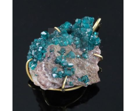 An Andrew Grima 18ct gold mounted diopside boulder pendant, stamped verso '0.750 Grima', overall 4cm, gross weight 22.9 grams